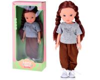 Bájos lány baba hosszú barna hajjal, sportos ruhában - 33cm